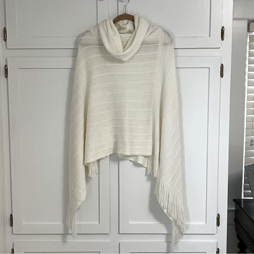 BCBG MaxAzaria soft cream colored poncho style sweater.